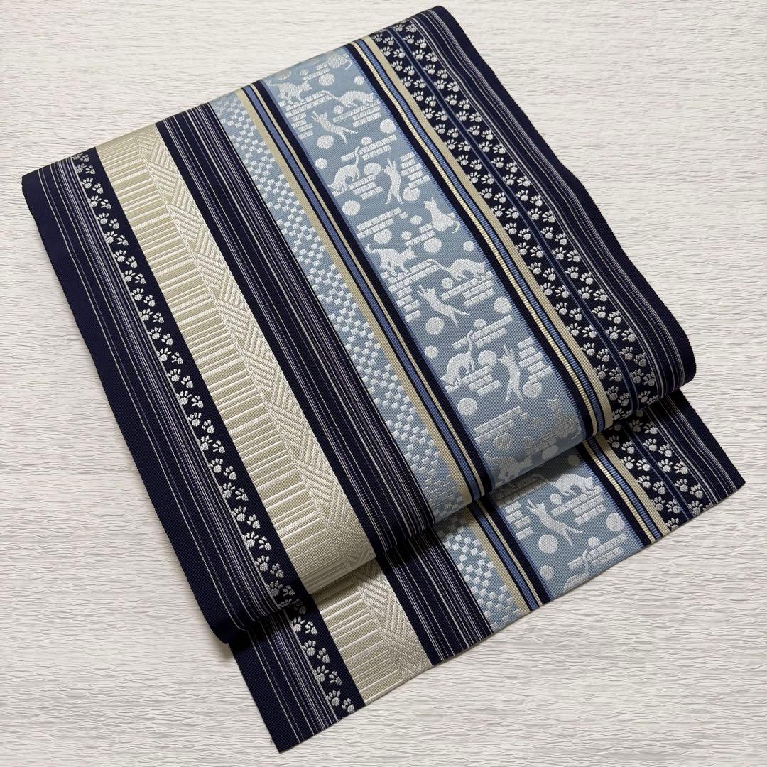 m-45 本場筑前博多織 黒木織物 猫 足跡 名古屋帯 正絹 未使用極美品