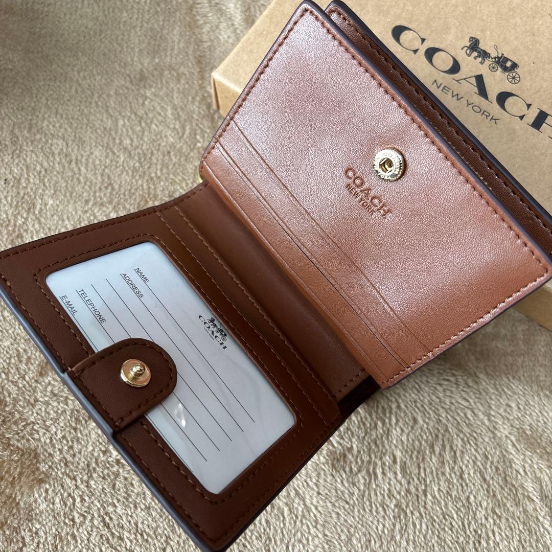 ゆかコーチ スナップウォレット シグネチャーキャンバス タン ブラウン