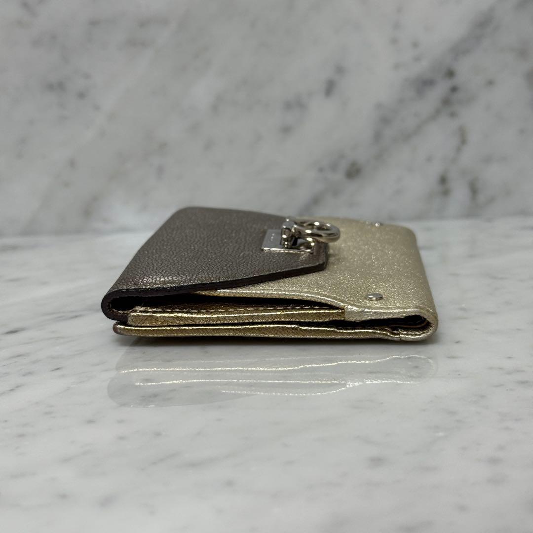 サルヴァトーレフェラガモ ゴールド シルバー 二つ折り財布 ガンチーニ