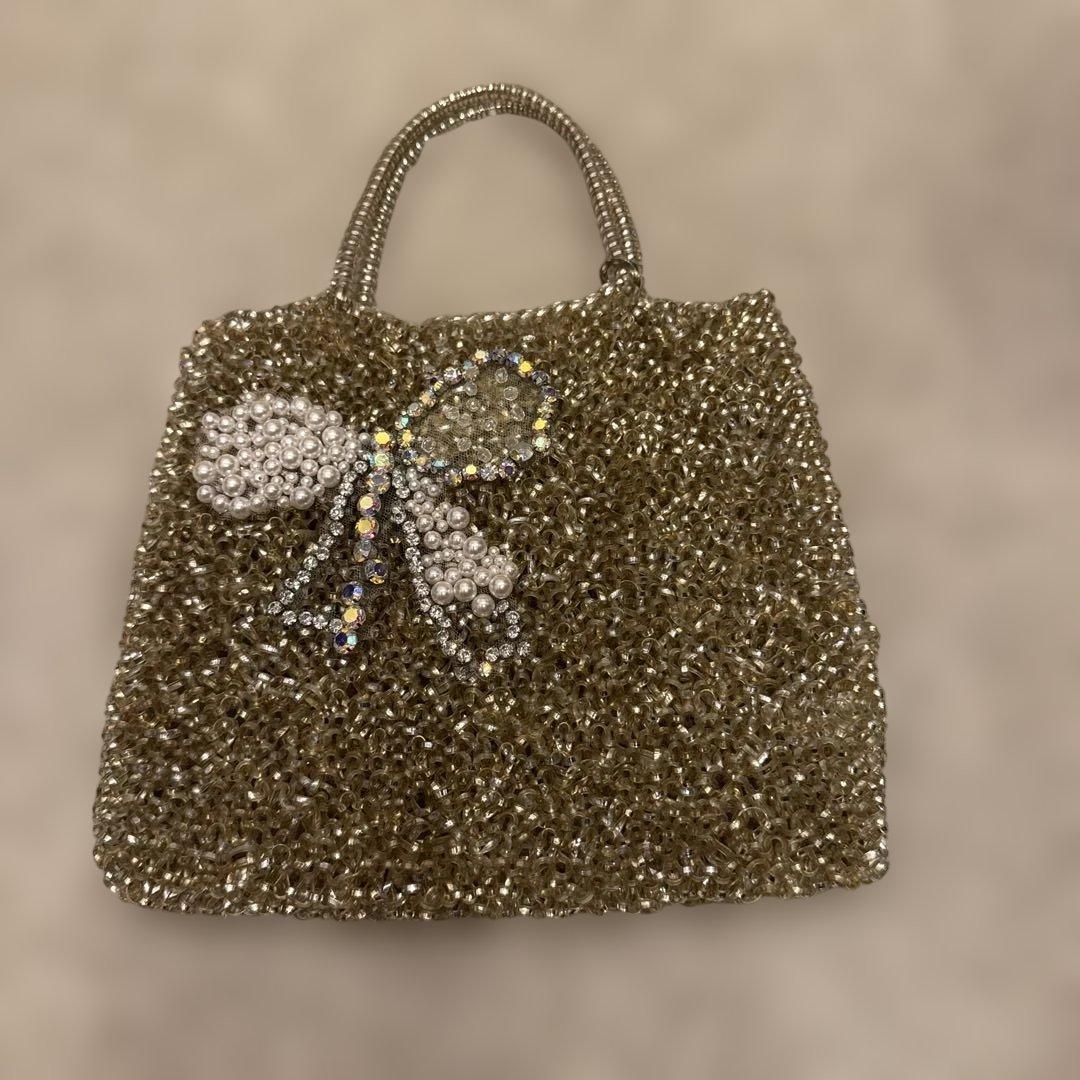 アンテプリマビジューリボンデザイン ゴールドハンドバッグ