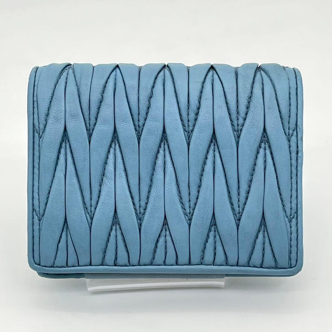 ミュウミュウ 二つ折り財布 マテラッセ クリスタル ビジュー ロゴ金具 レザー