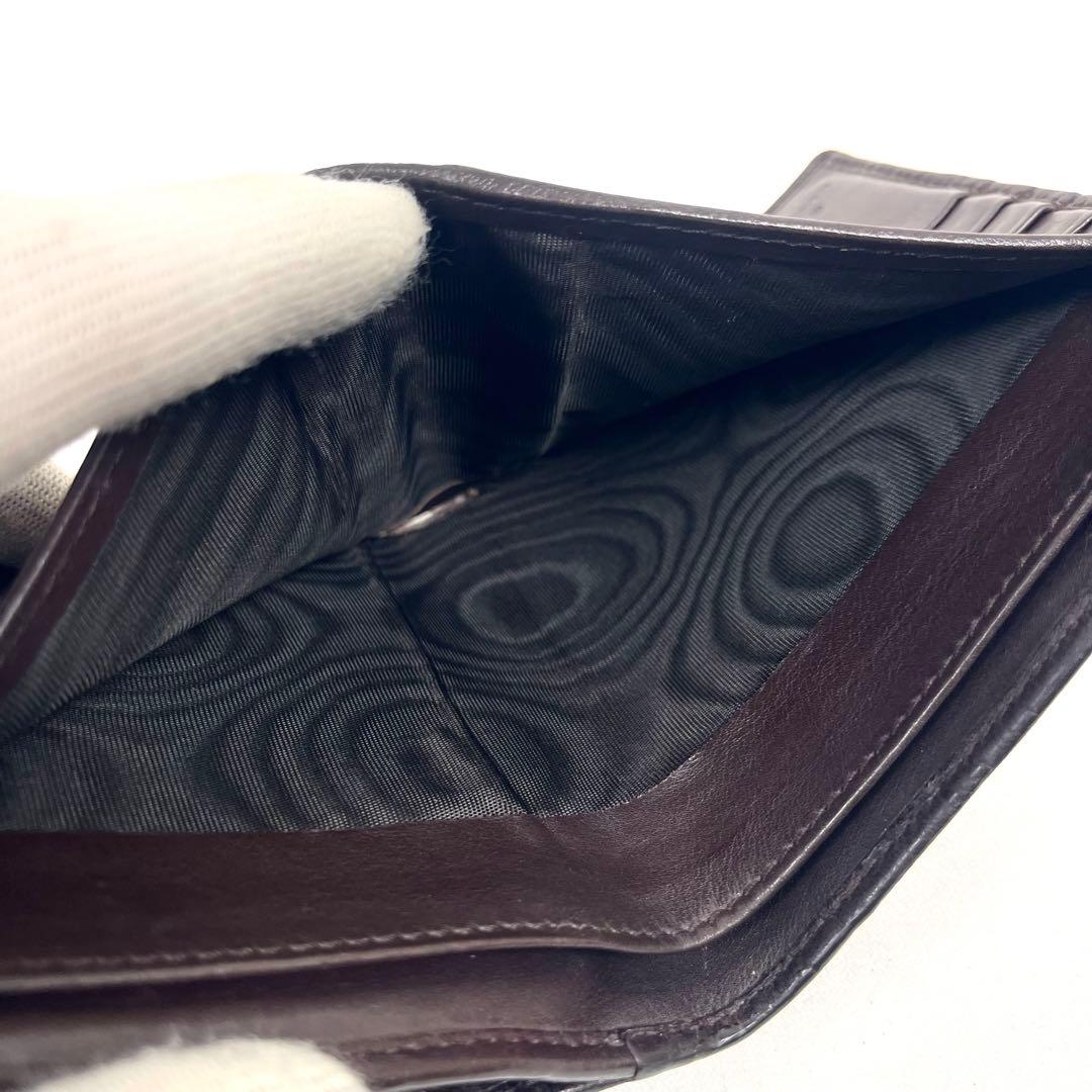 グッチ　二つ折り財布　アビー　シマレザー　ラウンドファスナー　ロゴ　エンボス