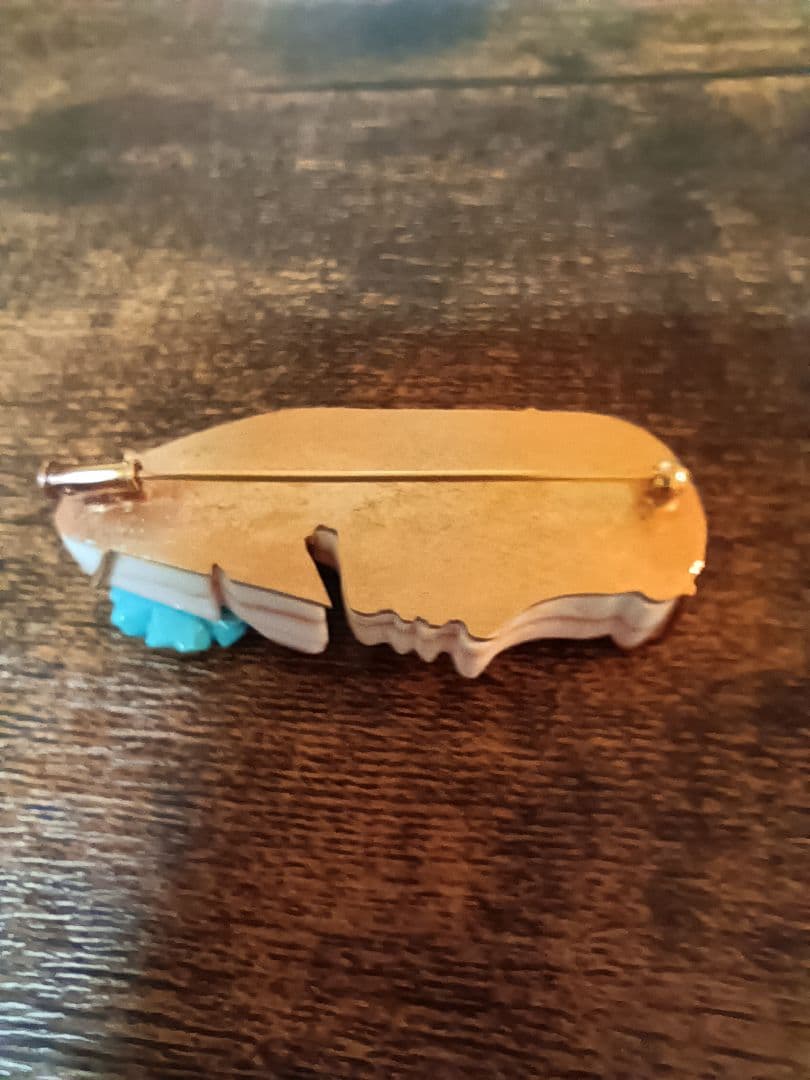 K18の女性横顔と花型ブルーストーン装飾ペンダント