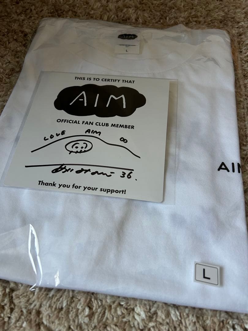 AIM限定デザインTシャツ＆直筆サイン入りミニ色紙セット