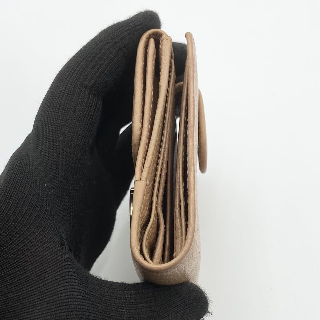 GUCCI インターロッキングG ダラーカーフ 二つ折り財布 ゴールド　ベージュ