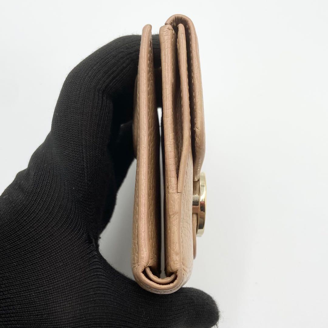 GUCCI インターロッキングG ダラーカーフ 二つ折り財布 ゴールド　ベージュ