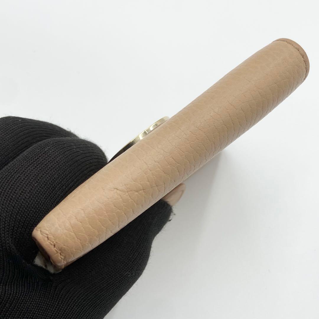 GUCCI インターロッキングG ダラーカーフ 二つ折り財布 ゴールド　ベージュ