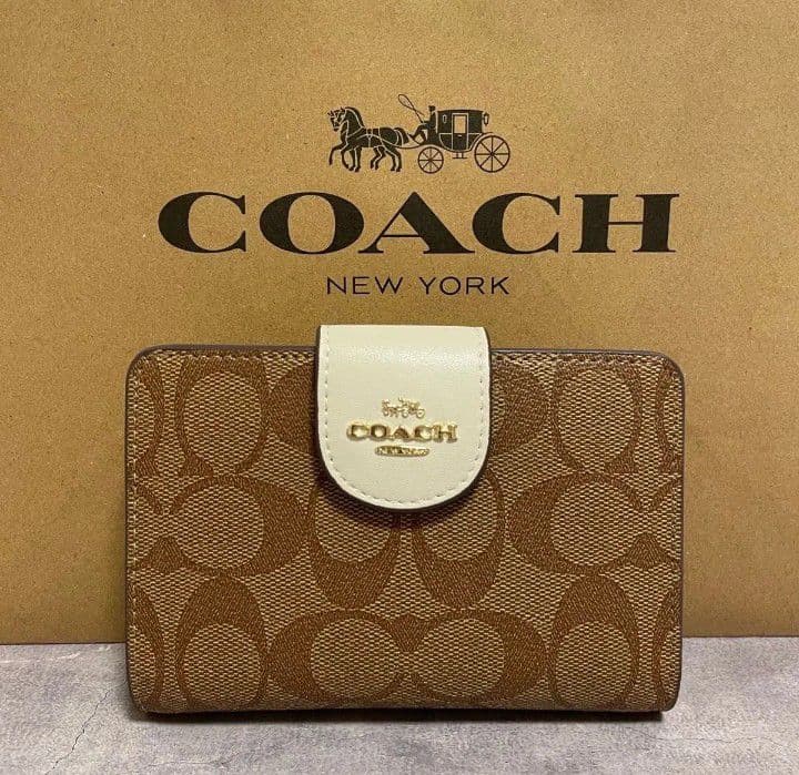 新品未使用コーチ二つ折り財布ベージュシグネチャーレディースメンズ送料無料即日発送