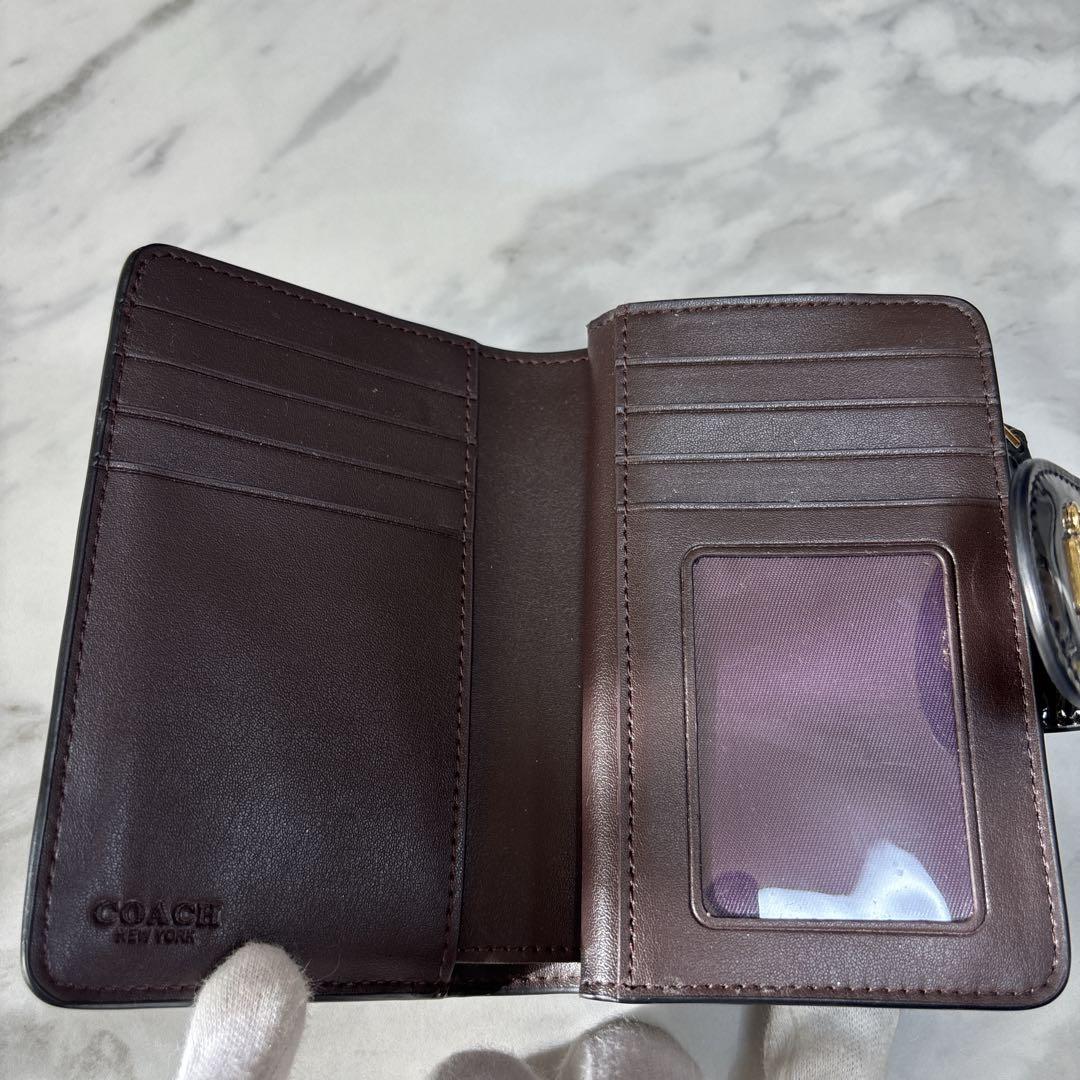 【美品】COACH コーチ 折り財布シグネチャーエンボス加工パテントレザー　黒