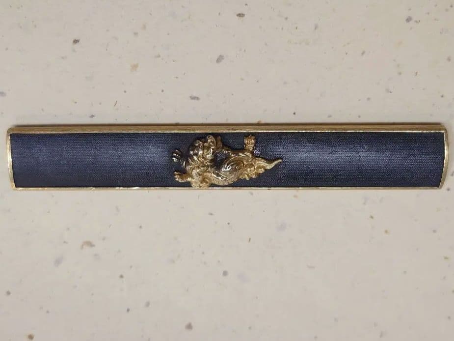 小柄袋、、赤銅魚子地に獅子図