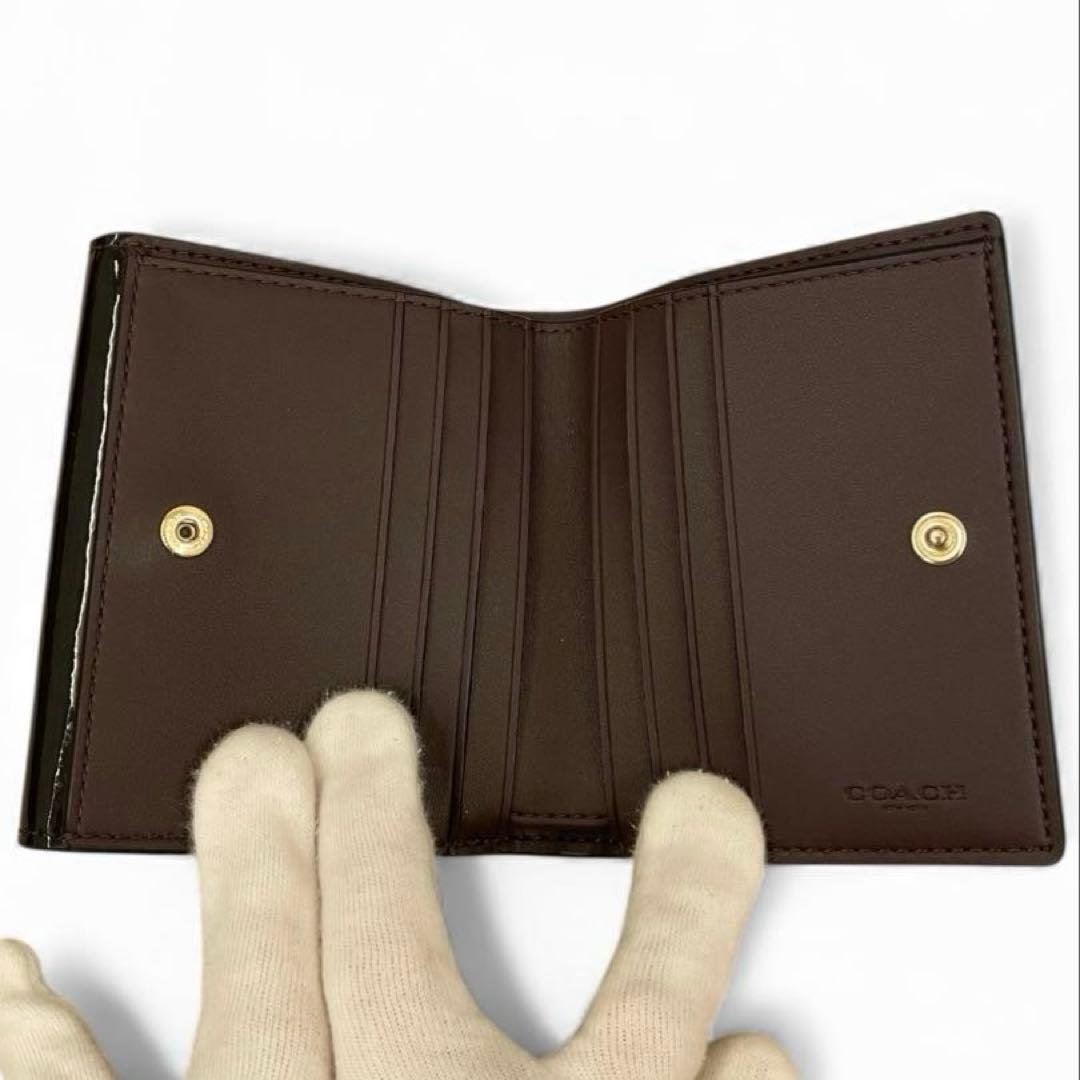 【未使用級】COACH 二つ折り財布 パテントレザー シグネチャー ブラック 黒