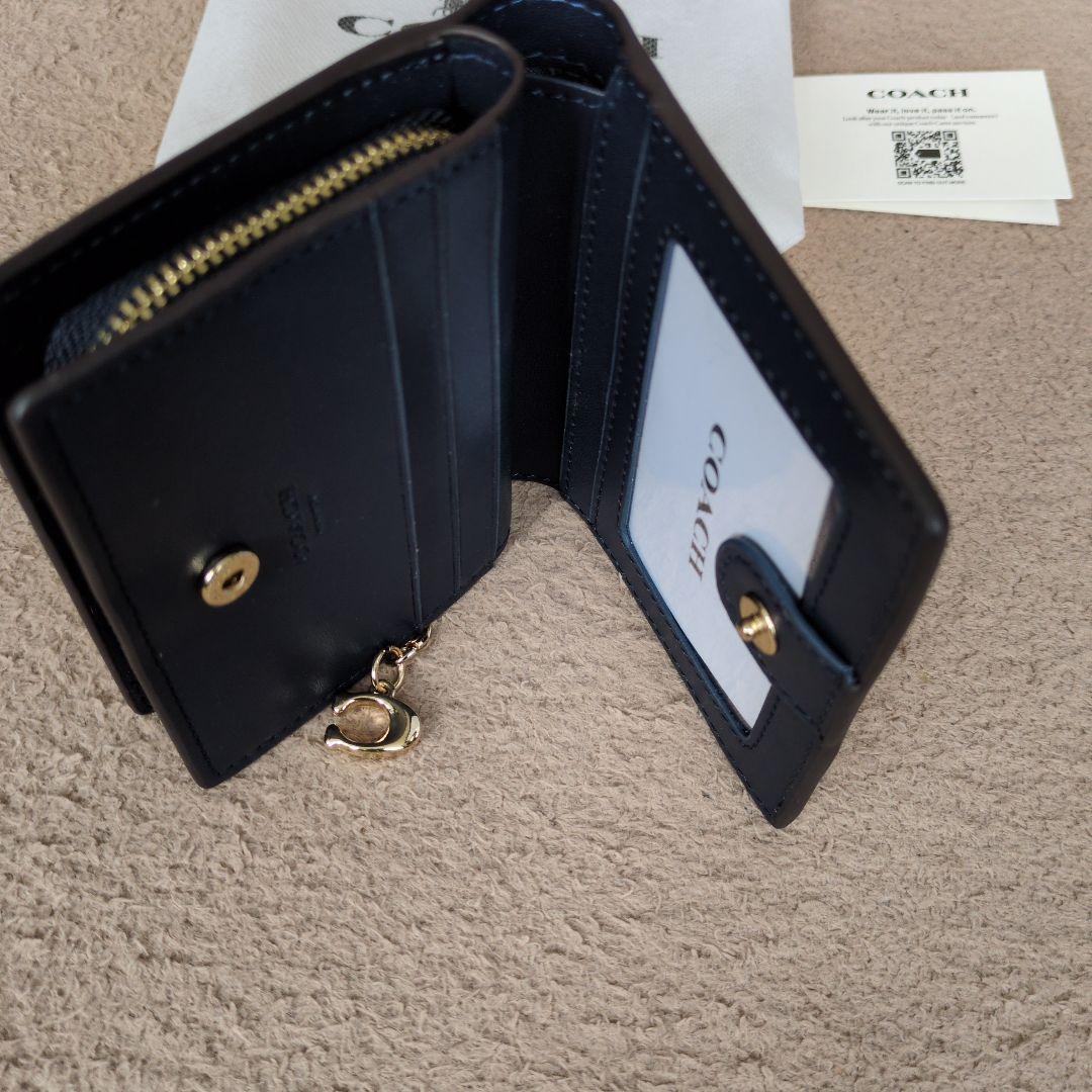 新品未使用COACH 二つ折り財布 デニムブルー ロゴ入り