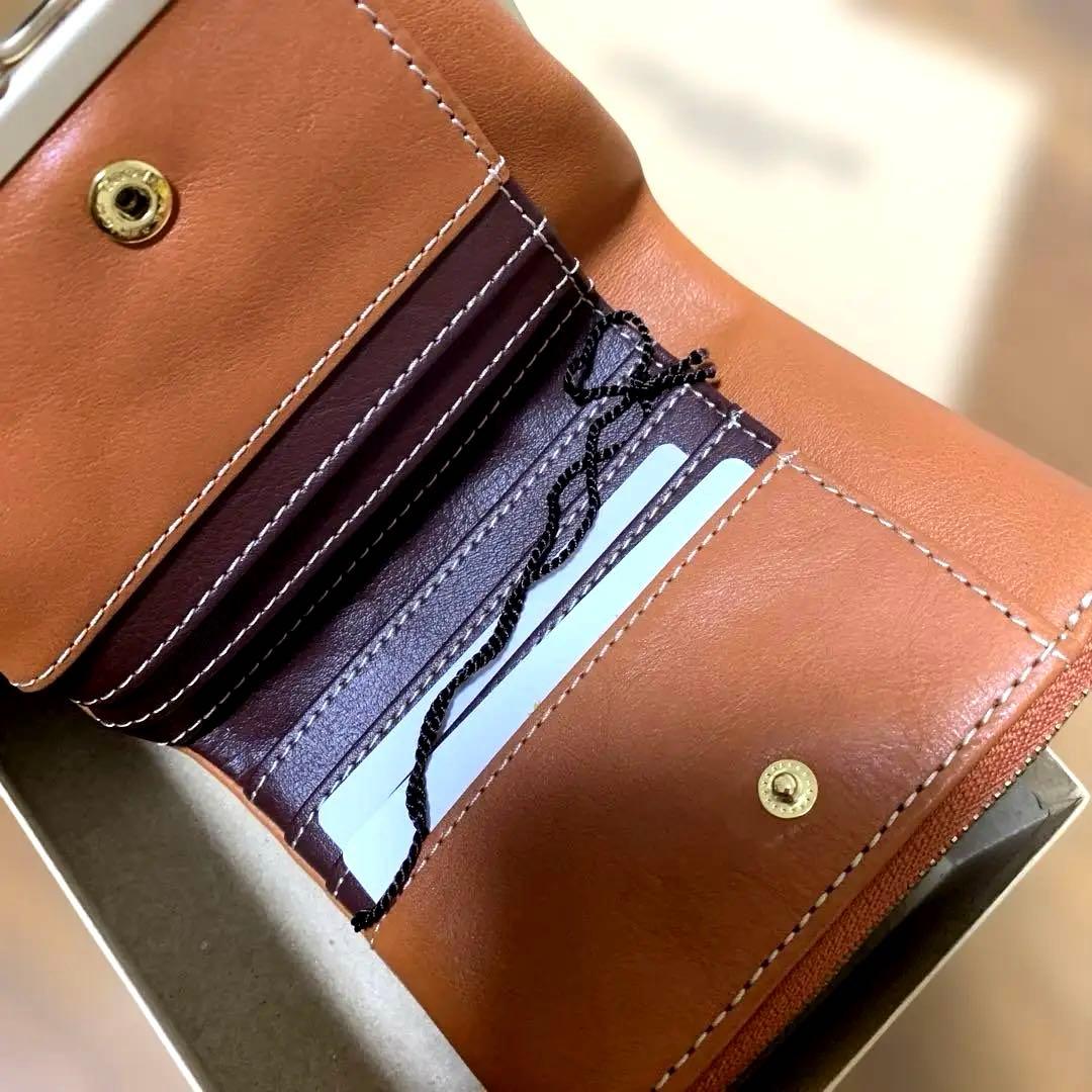 新品未使用 タグ箱付き ズッケロ がま口 二つ折り 財布 オレンジ