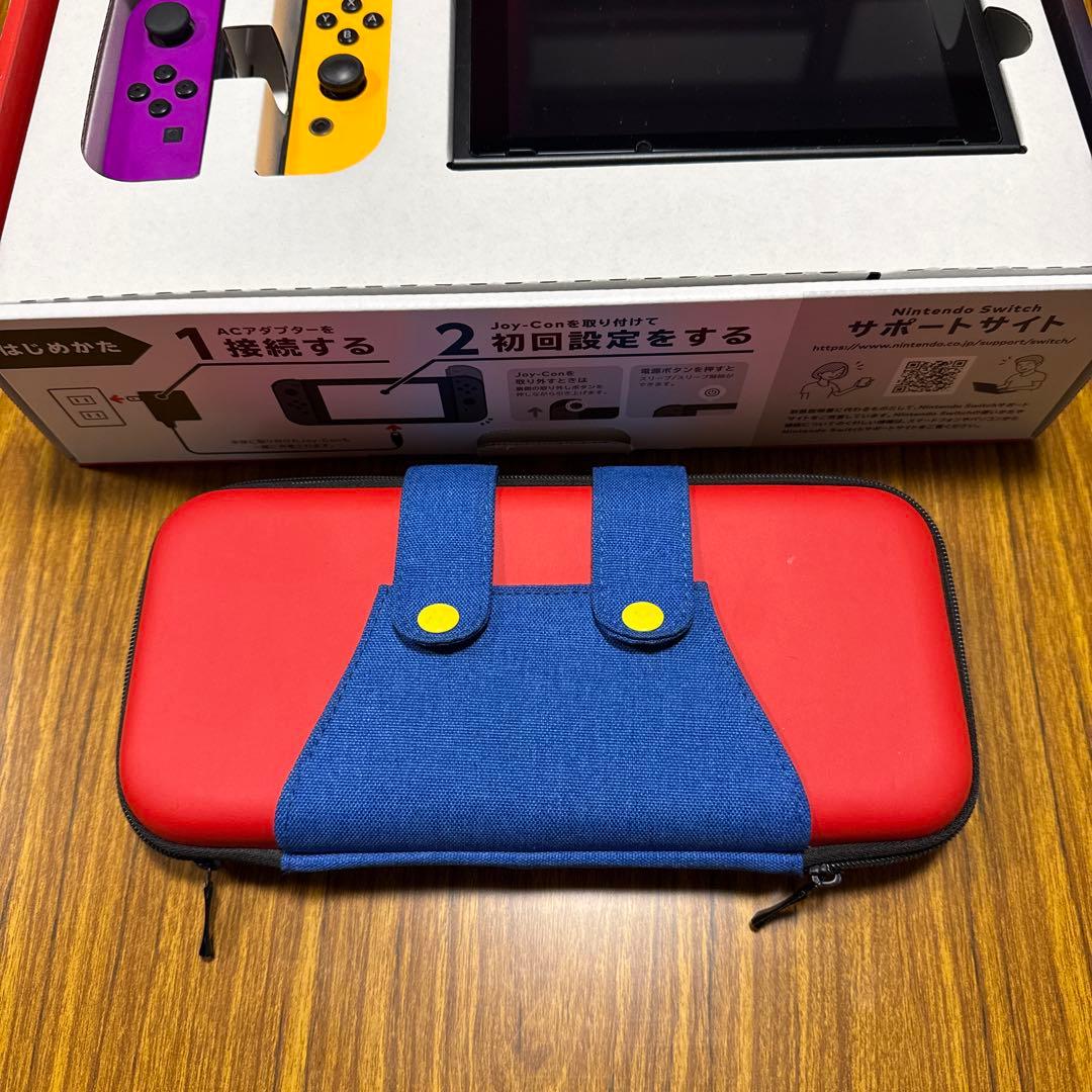 Nintendo Switch 本体 紫とオレンジのJoy-Conセット。