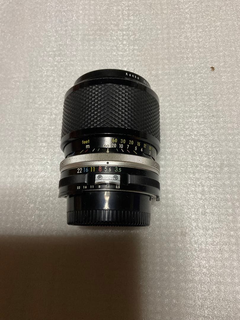 NIKOMAT・EL。一眼レフカメラ。ナショナルPE-32Sフラッシュ付き。