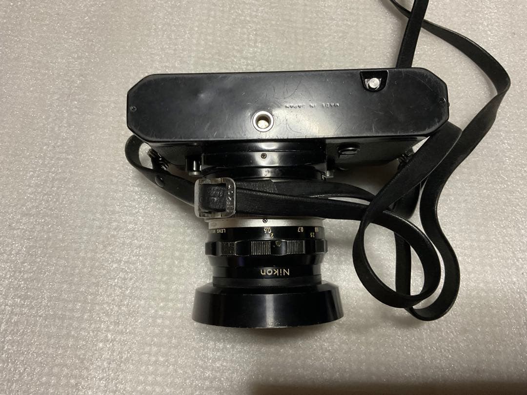 NIKOMAT・EL。一眼レフカメラ。ナショナルPE-32Sフラッシュ付き。