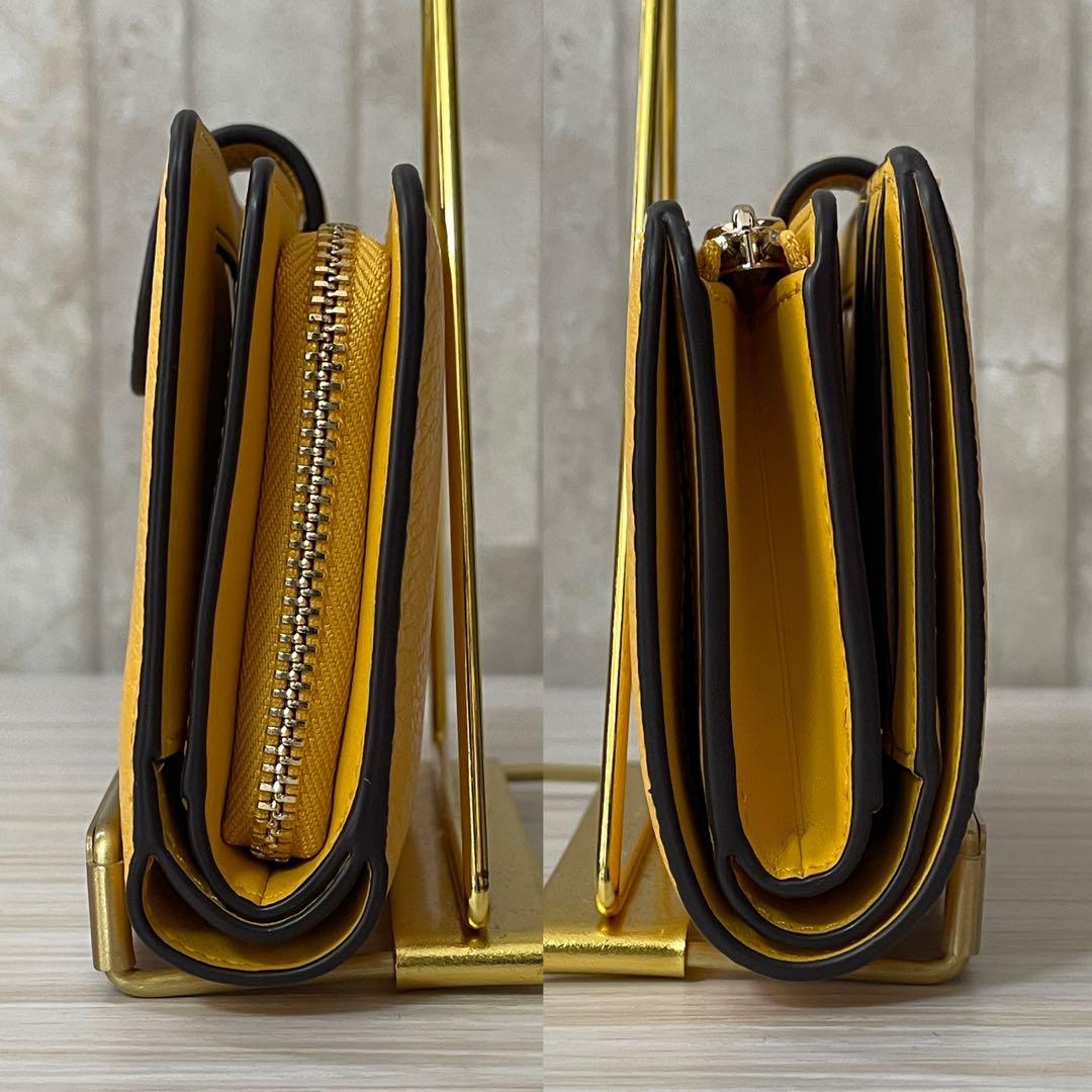 早い者勝ち！訳あり新品 kate spade 二つ折り財布 イエロー