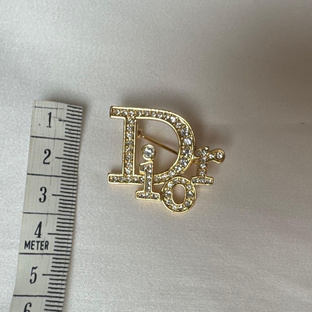 クリスチャンディオール ロゴブローチ ゴールド トロッター