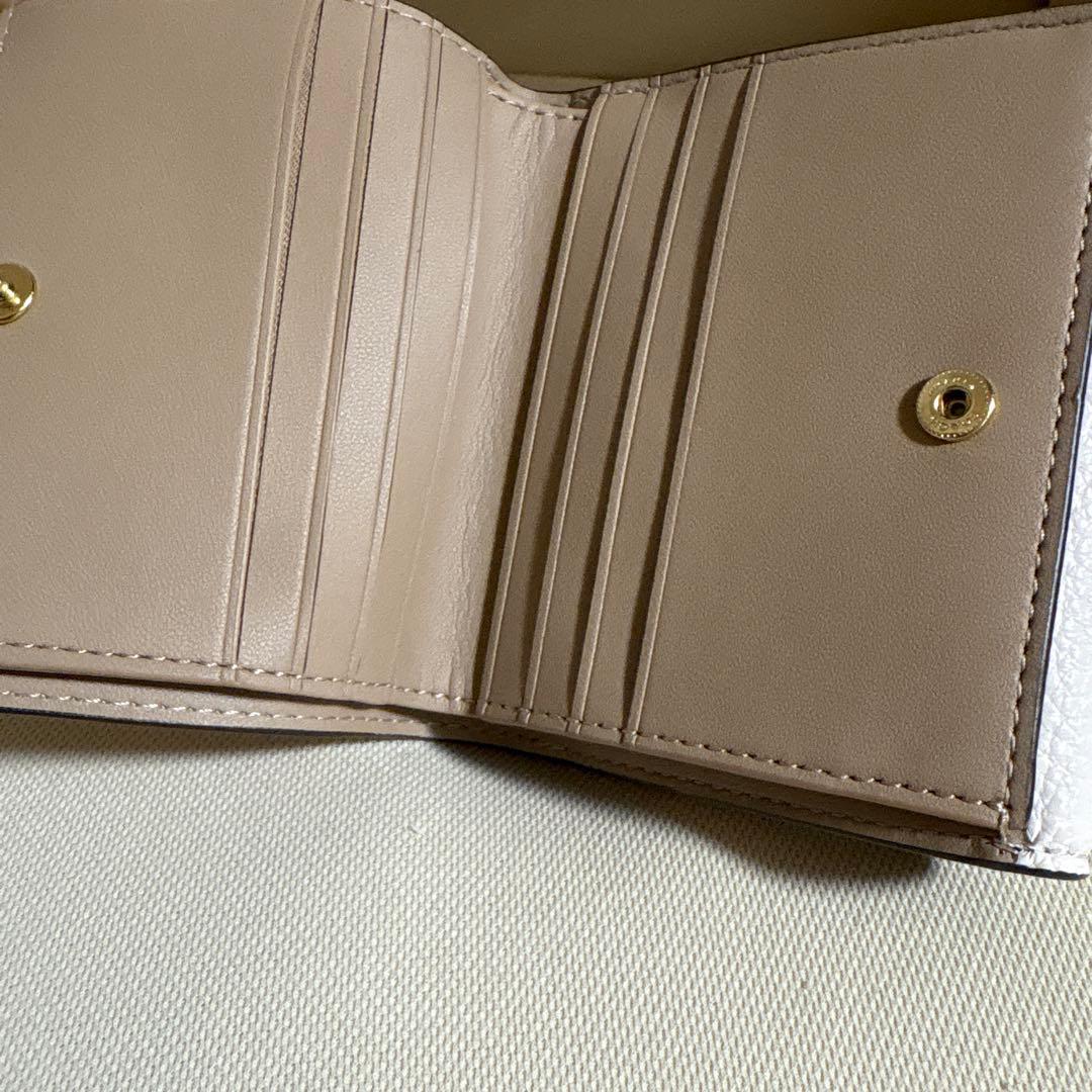 さとる様！専用商品！！COACH 花と蝶のプリント 二つ折り財布