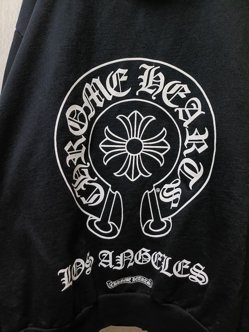 CHROME HEARTSバックホースシュープリントダガージップアップパーカー