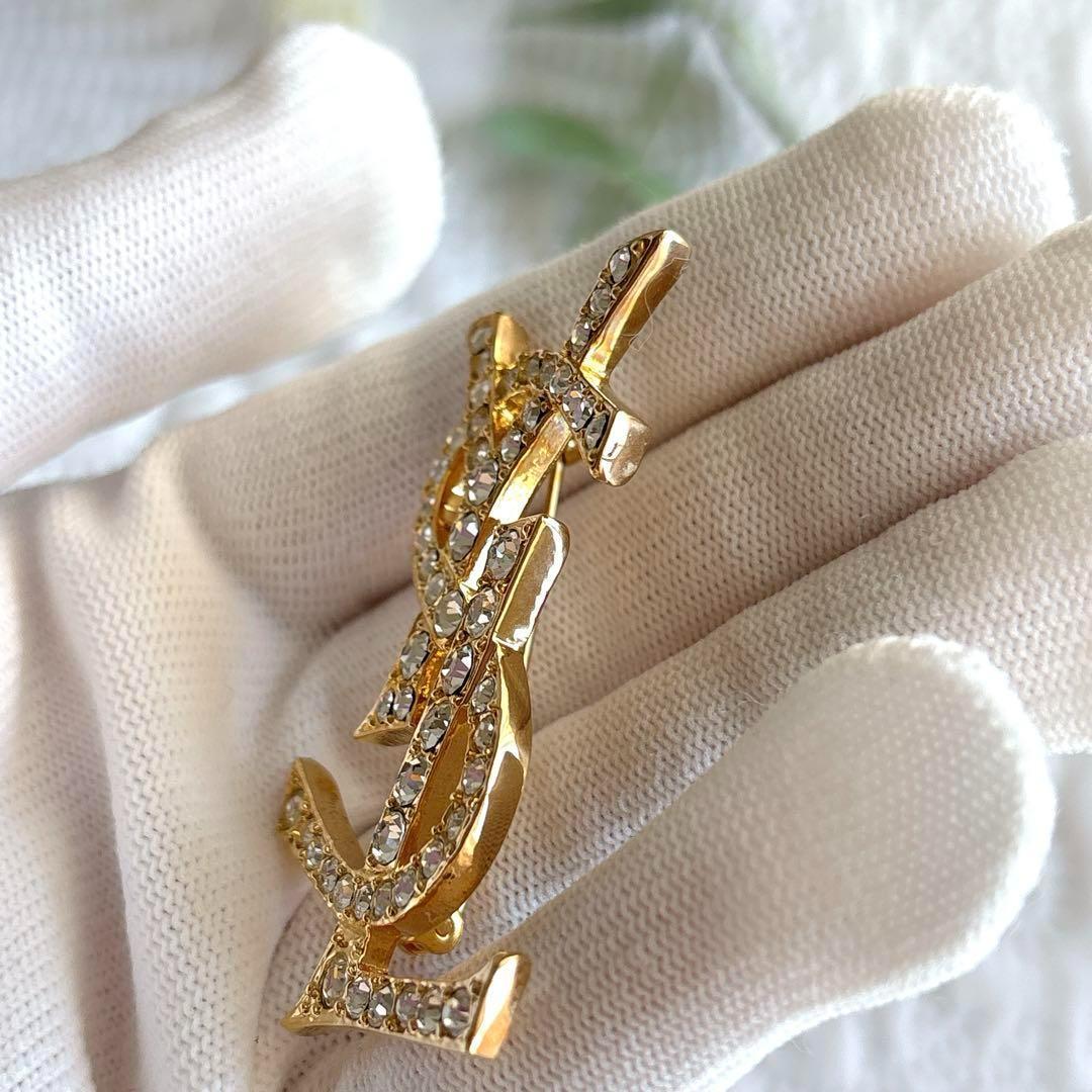 極美品 イヴサンローラン ブローチ カサンドラ ロゴ YSL ゴールド 人気