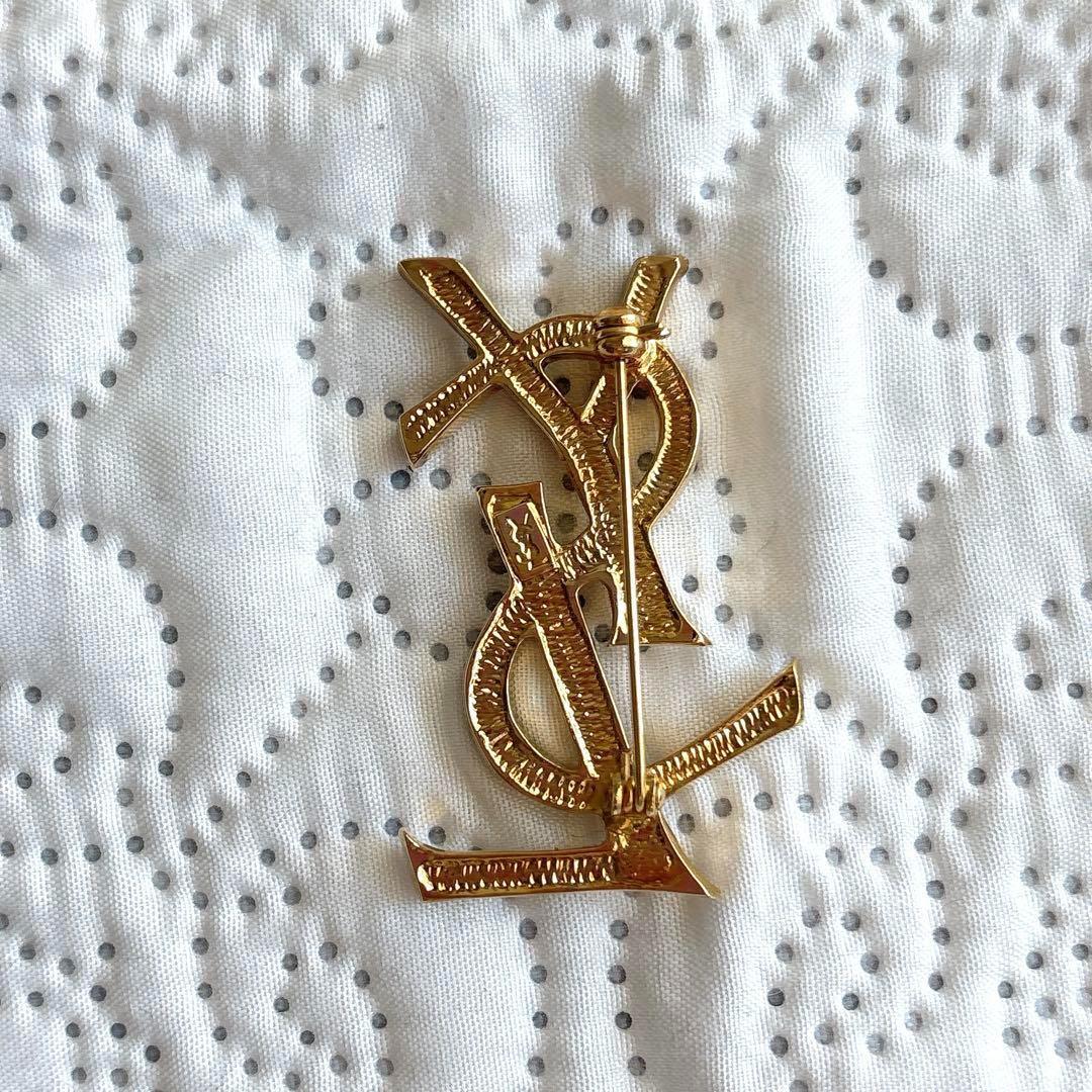 極美品 イヴサンローラン ブローチ カサンドラ ロゴ YSL ゴールド 人気