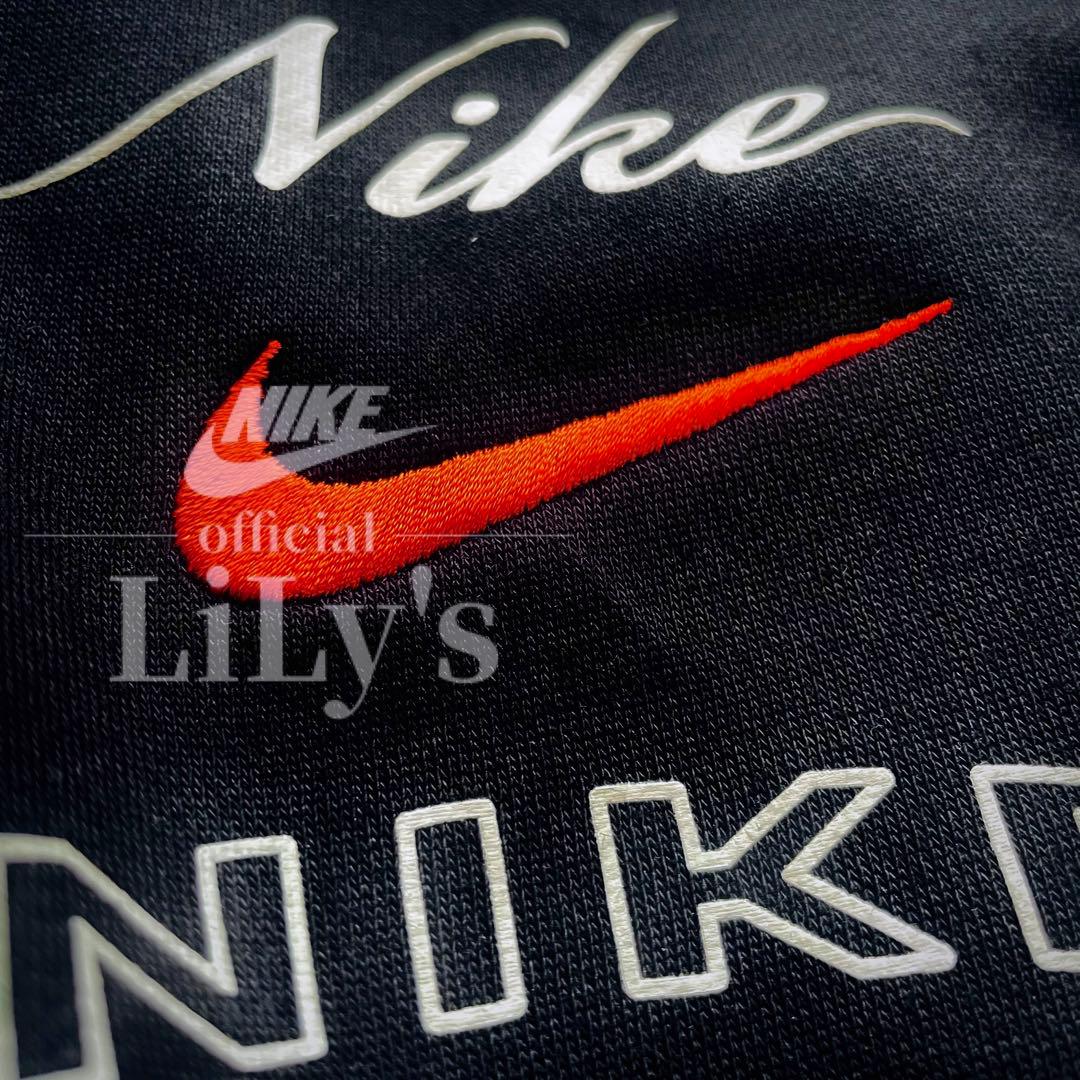 【Ｍサイズ】新品未使用　ナイキ上下セットアップ　ブラック✖︎オレンジ　黒　ロゴ刺繍