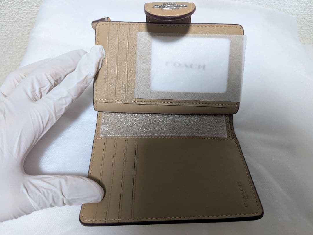 COACH 二つ折り財布 シグネチャー柄 ベージュ CW786