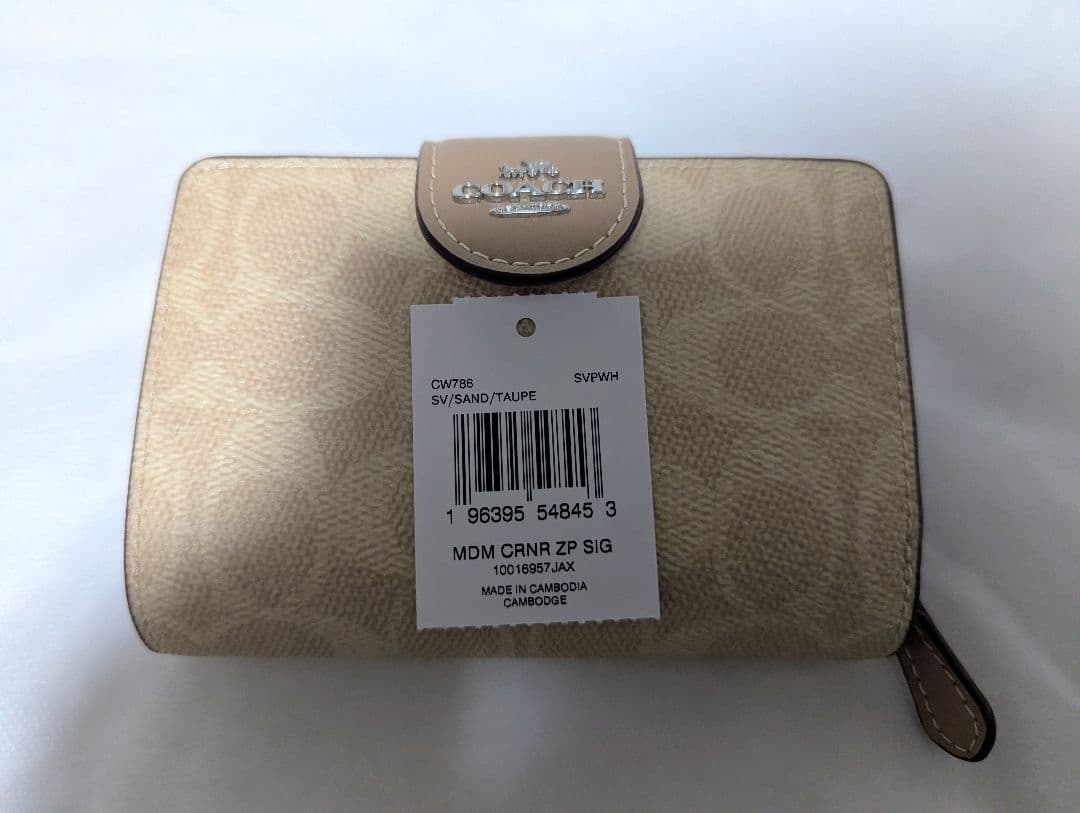 COACH 二つ折り財布 シグネチャー柄 ベージュ CW786