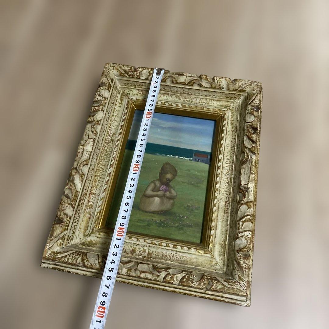 海辺の少女の油彩画