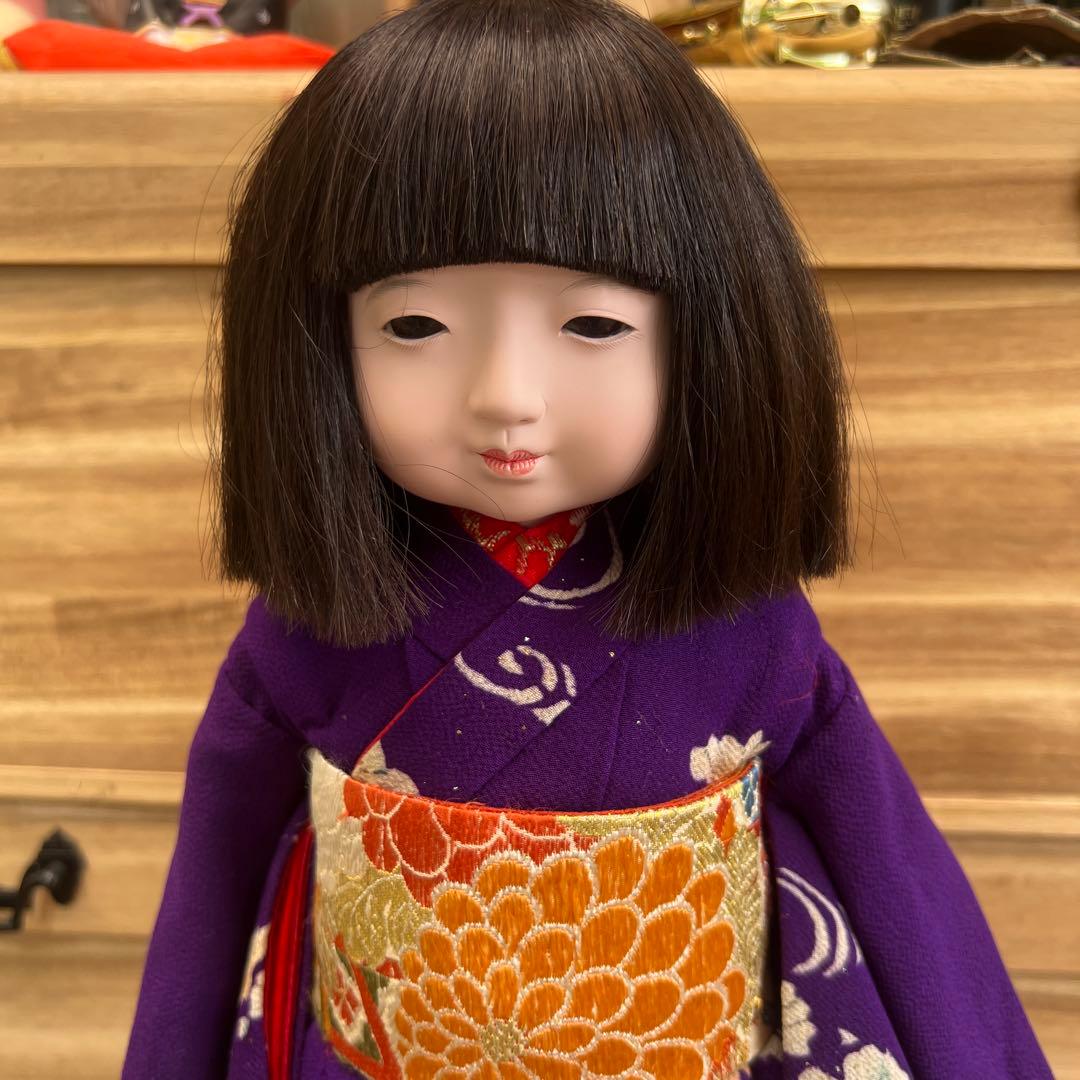 紫色の花柄御所人形