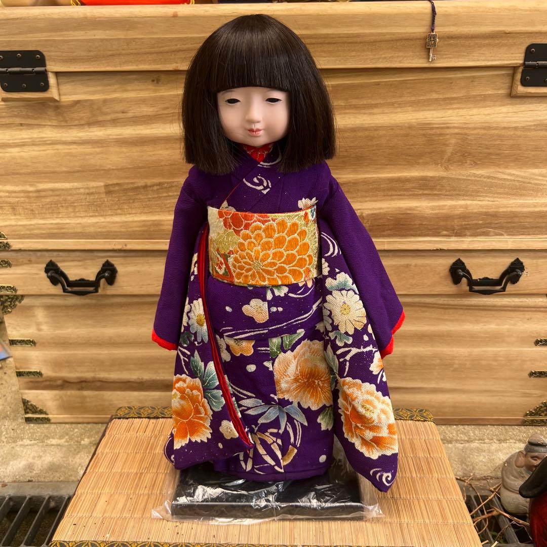 紫色の花柄御所人形