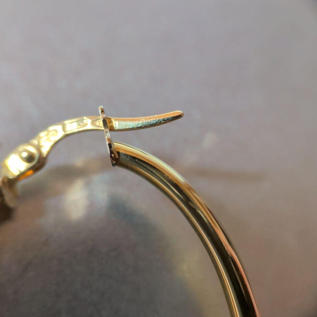 ピアス　UNOAERRE　750　YG　スナップ　ウェーブ　2.59g