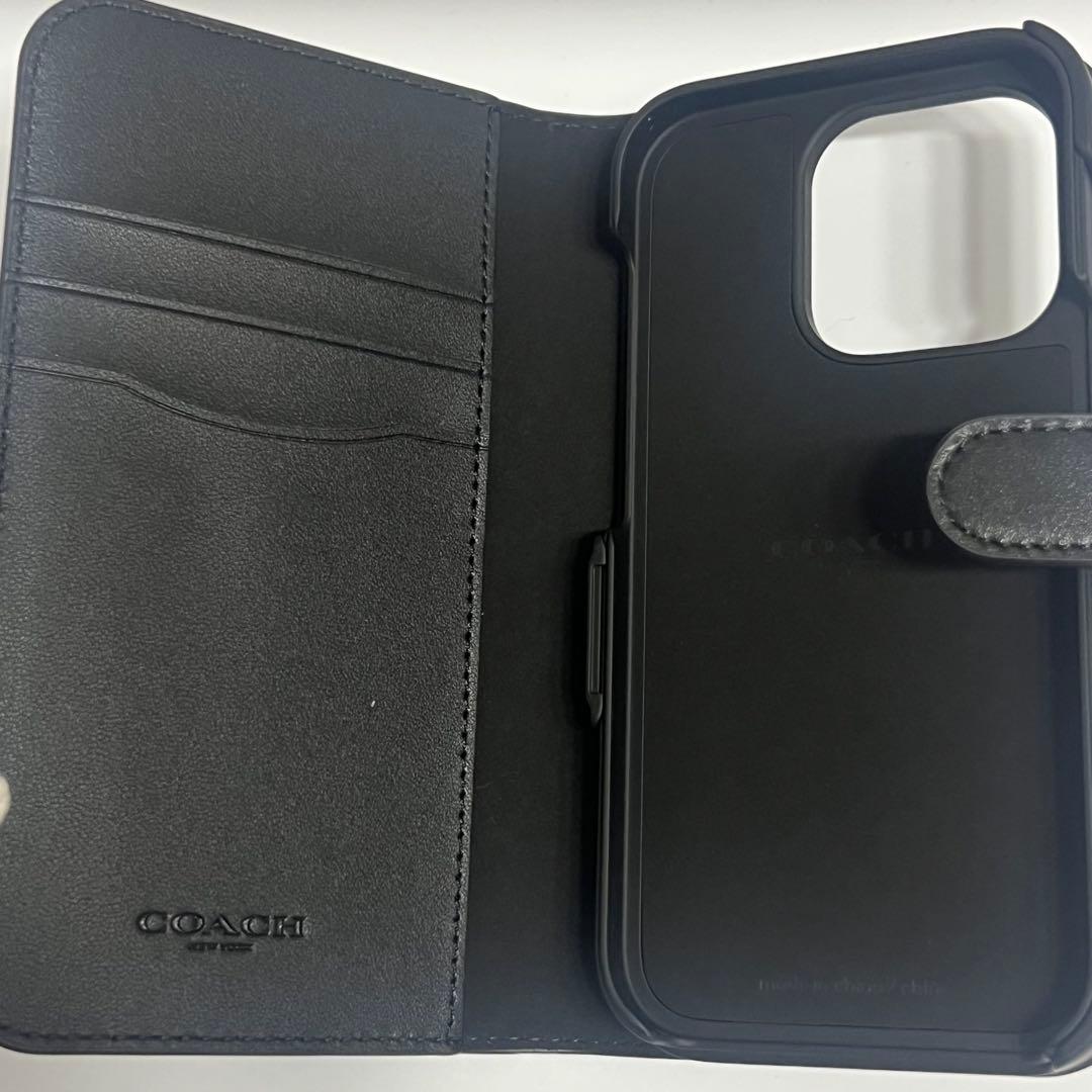 COACH iPhone14PROケース フォリオ・シグネチャー キャンバス