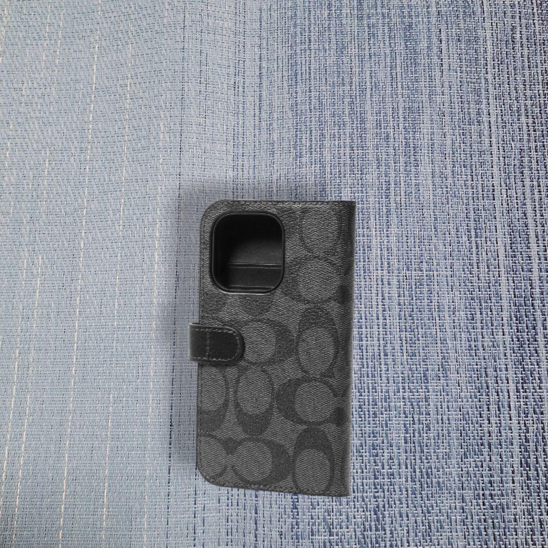 COACH iPhone14PROケース フォリオ・シグネチャー キャンバス