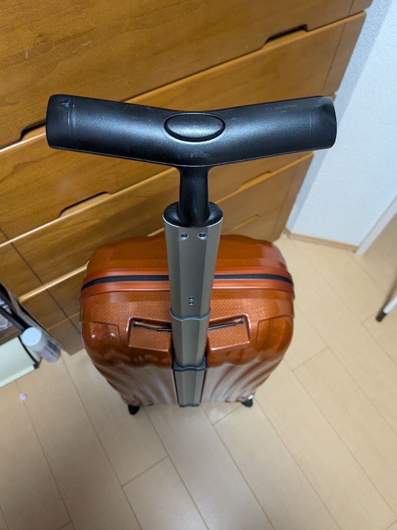 サムソナイト 波状テクスチャー キャリーケース コスモライト 4輪 オレンジ