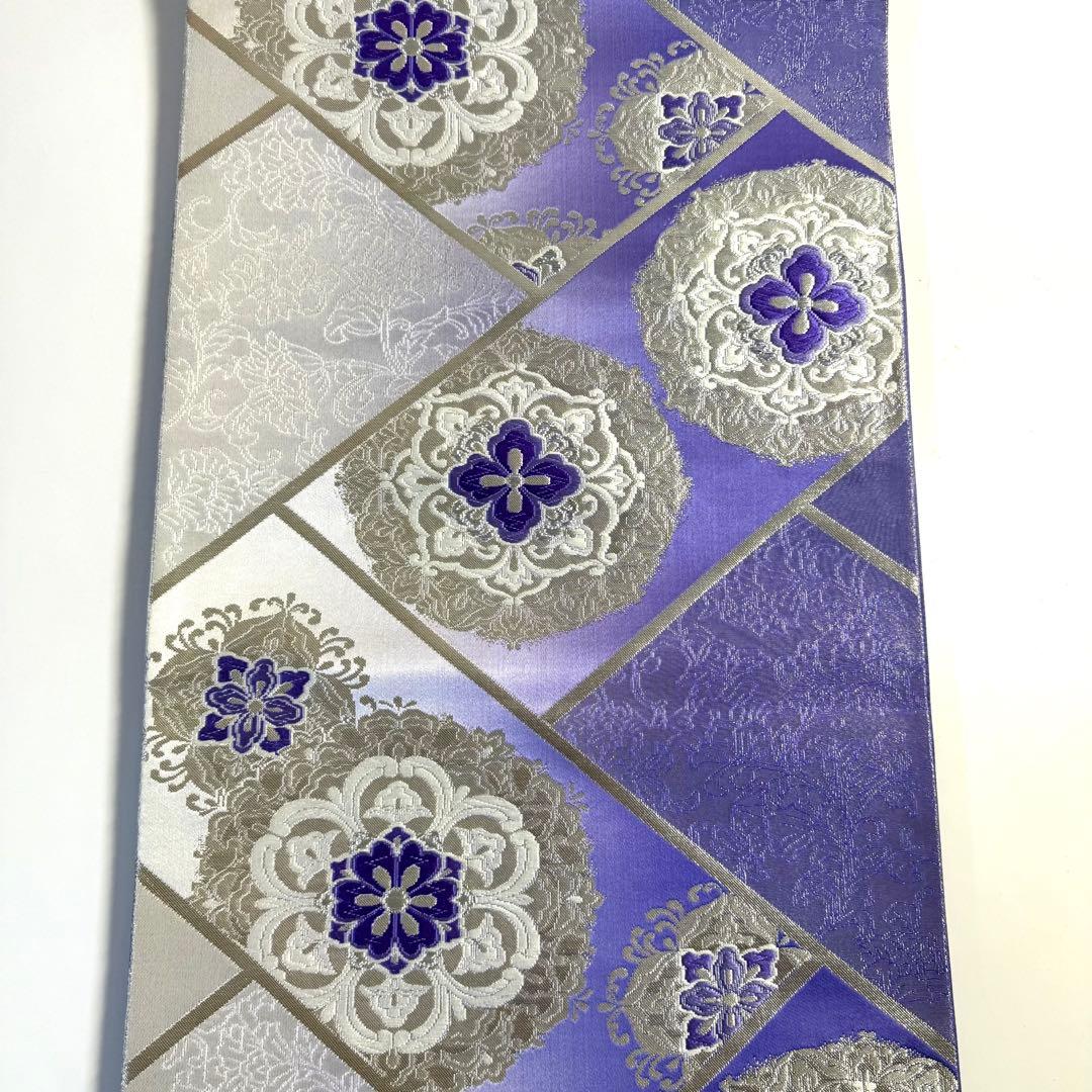 5k2491 袋帯　絹　唐織　正倉院文様　華文　紫　銀色　白　花柄　和装　着物