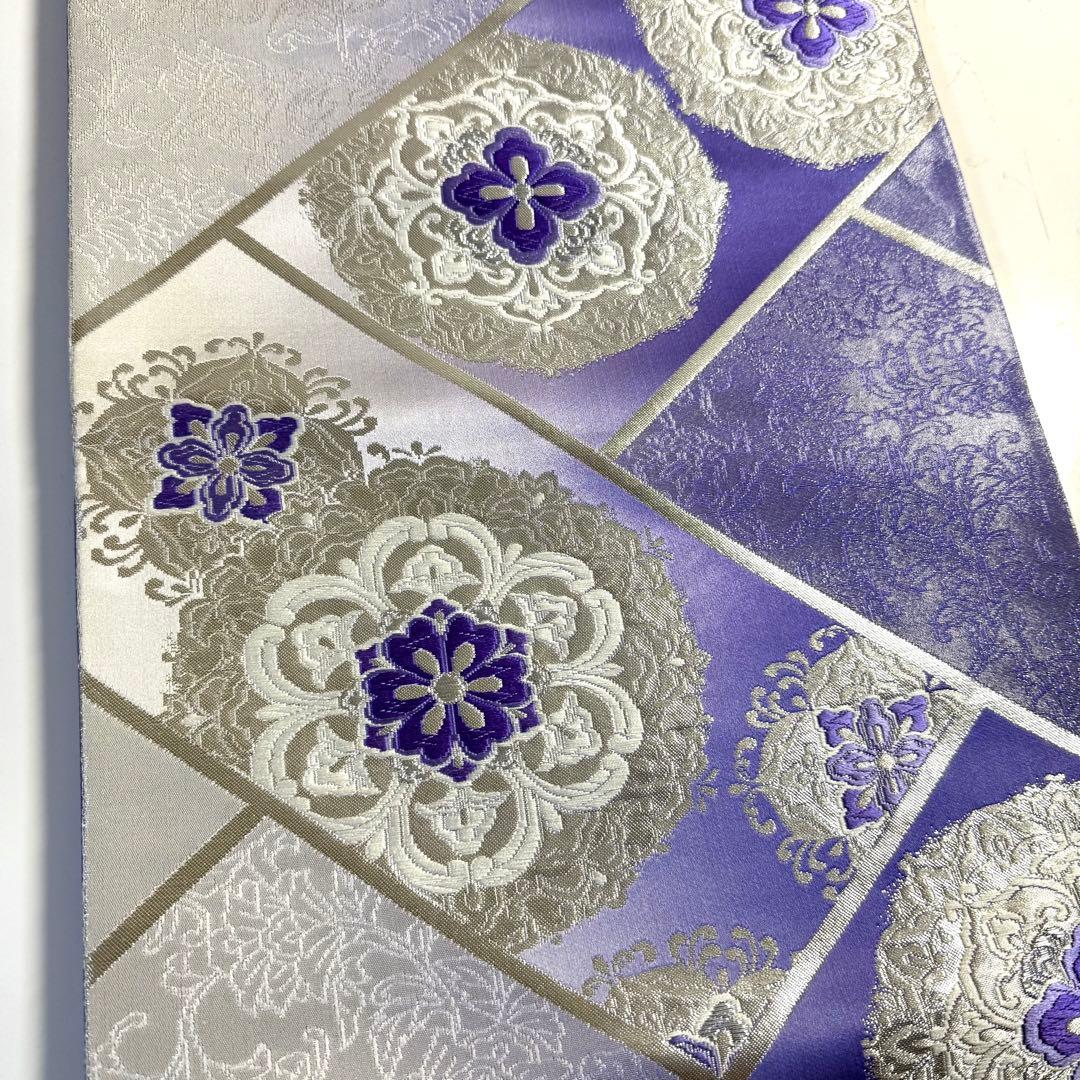 5k2491 袋帯　絹　唐織　正倉院文様　華文　紫　銀色　白　花柄　和装　着物