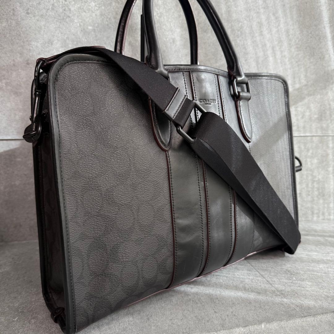 良品 コーチ ビジネスバッグ A4収納可 シグネチャー F23212