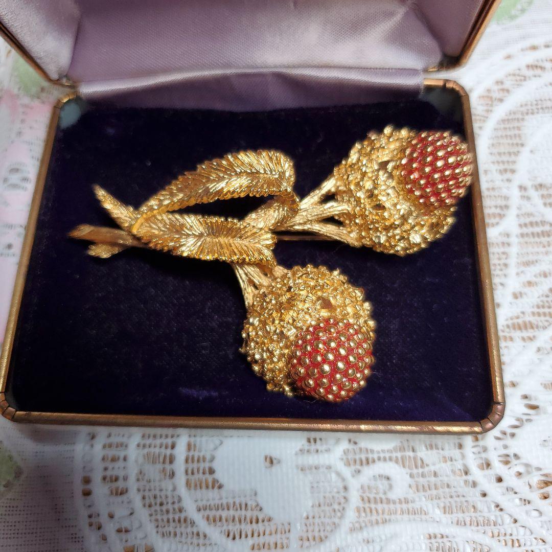 Carven 金色の花束ブローチ