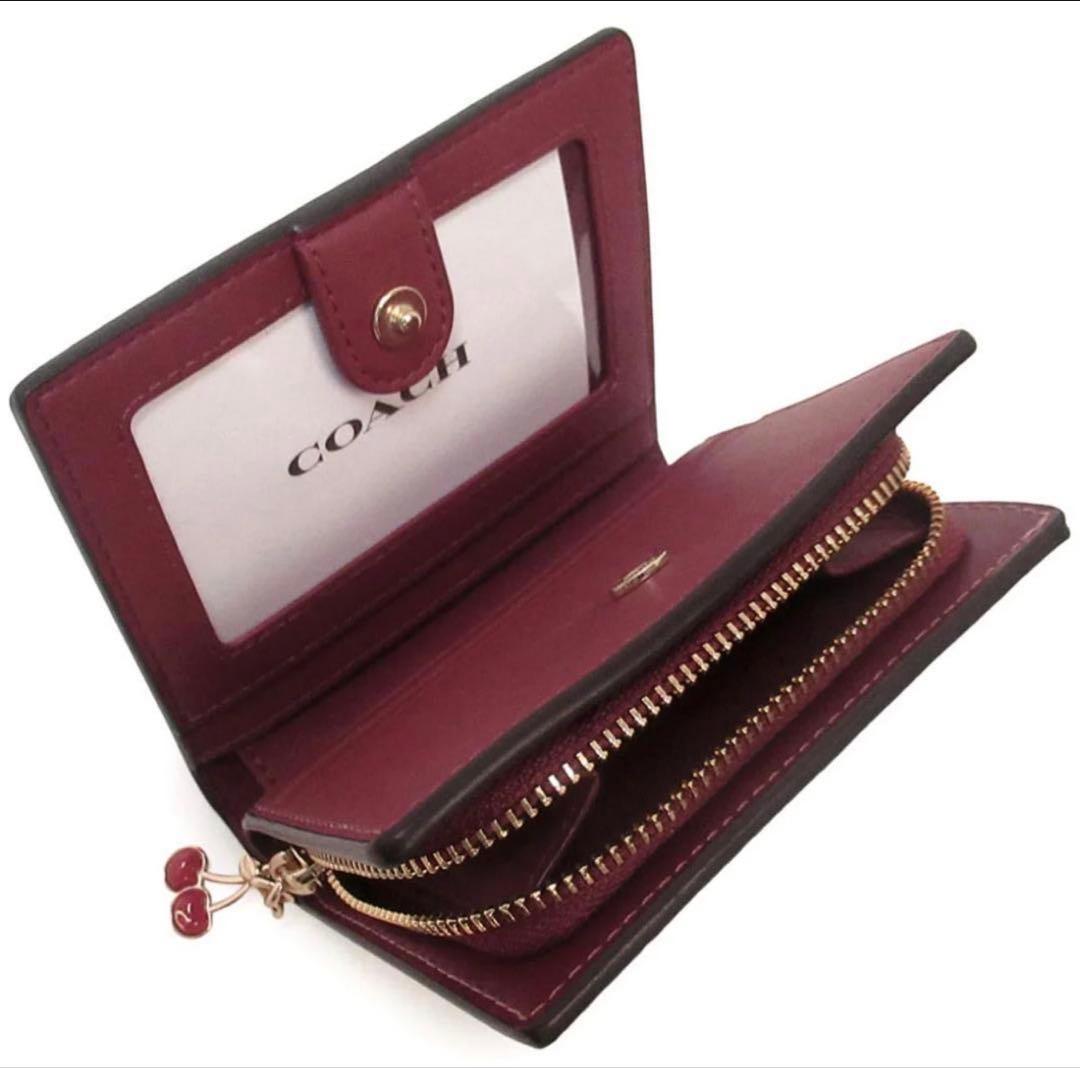 ぽ*ず様 初売り　COACH シグネチャーチェリープリント二つ折り財布、さくらん