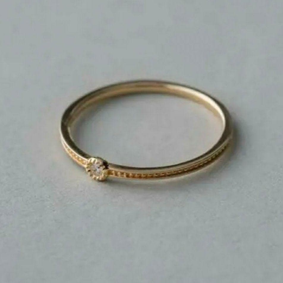 エテ K10YG レイヤード ミル打ち 1粒ダイヤモンド リング