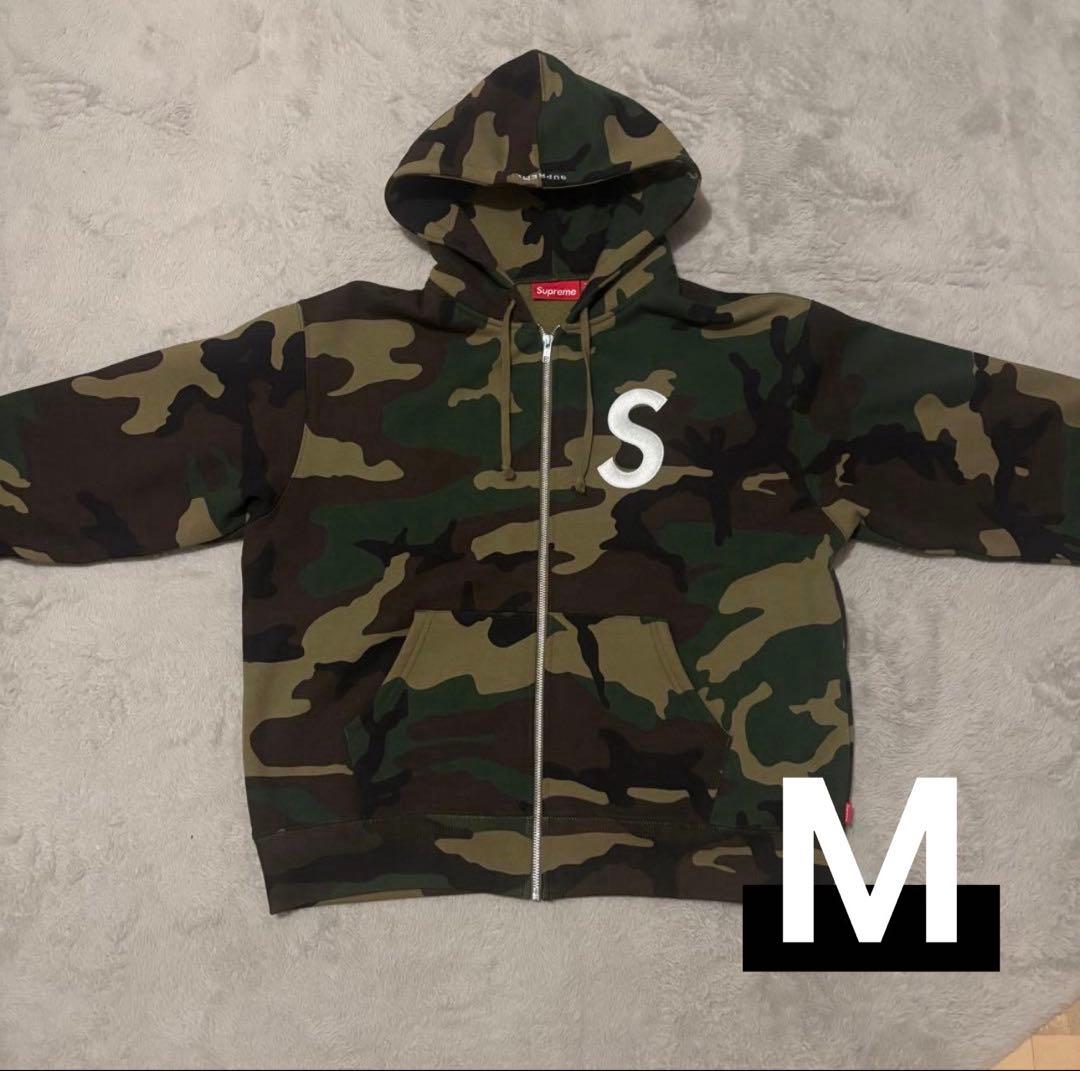 シュプリーム Sロゴジップアップ フーデッド ウッドランドカモ