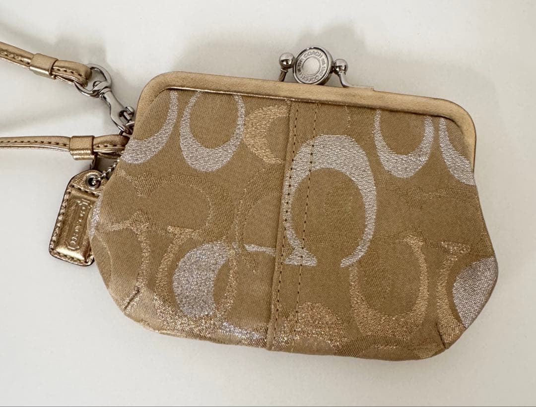 COACH がま口　キスロック　クラッチ　ゴールドラメ　コーチ