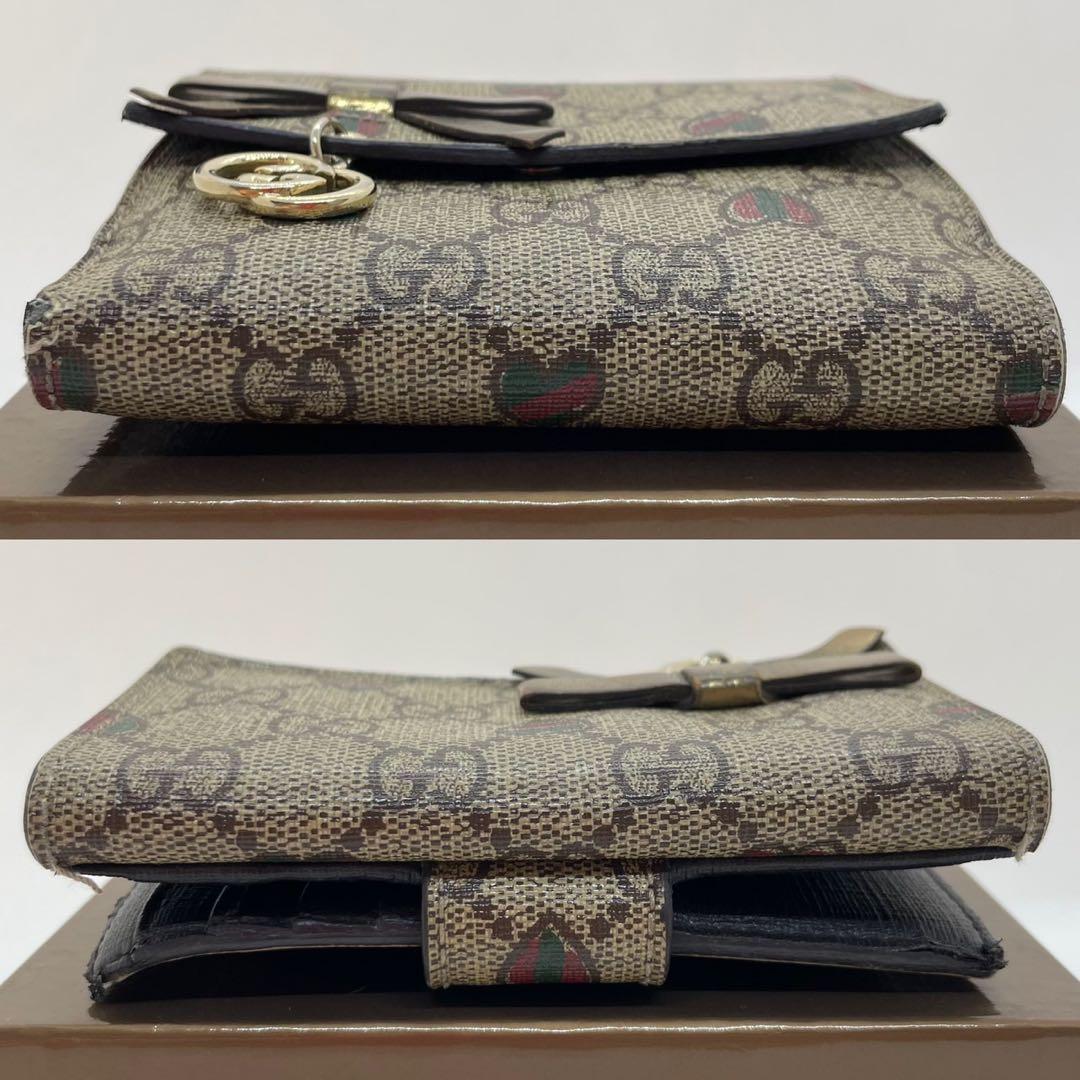 【美品/付属品完備】グッチ 二つ折り財布 小銭 GGシマ リボン ロゴチャーム