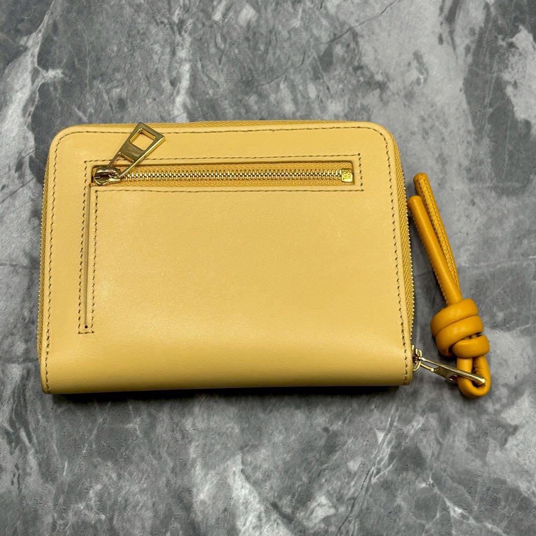 あらいぐま✨LOEWE ノット コンパクトウォレット イエローベージュ 財