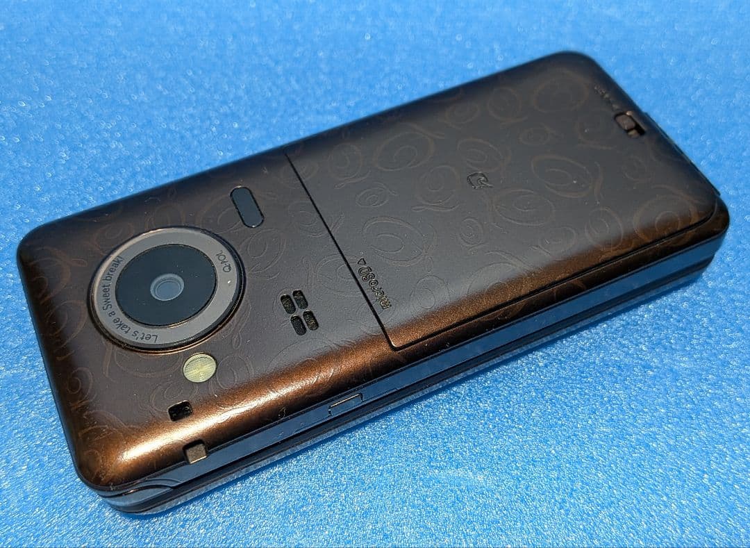 Q-pot. Phone SH-04C docomo チョコレートビスケット