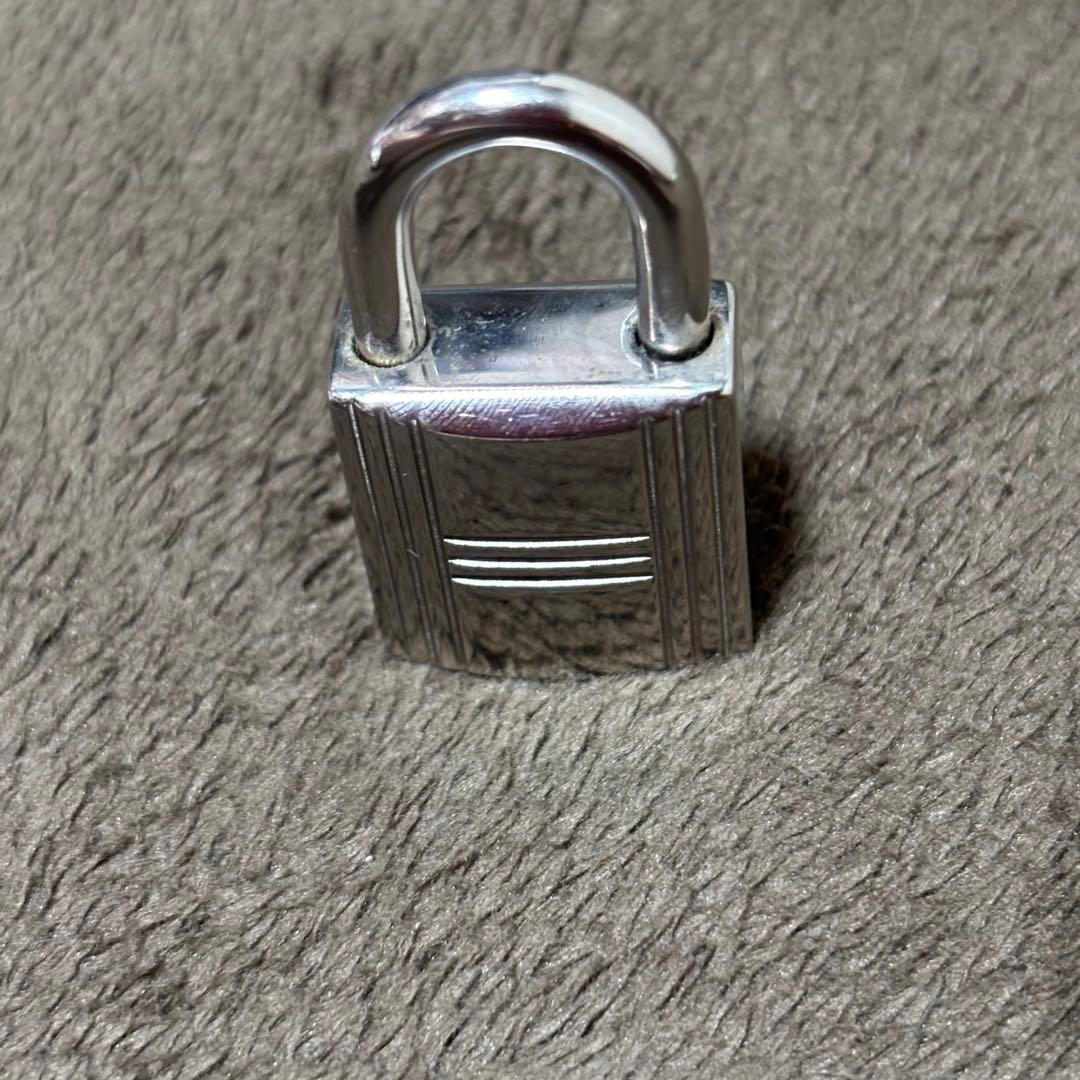 Hermèsエルメスエールラインリュックシルバーカデナ南京錠。鍵なし