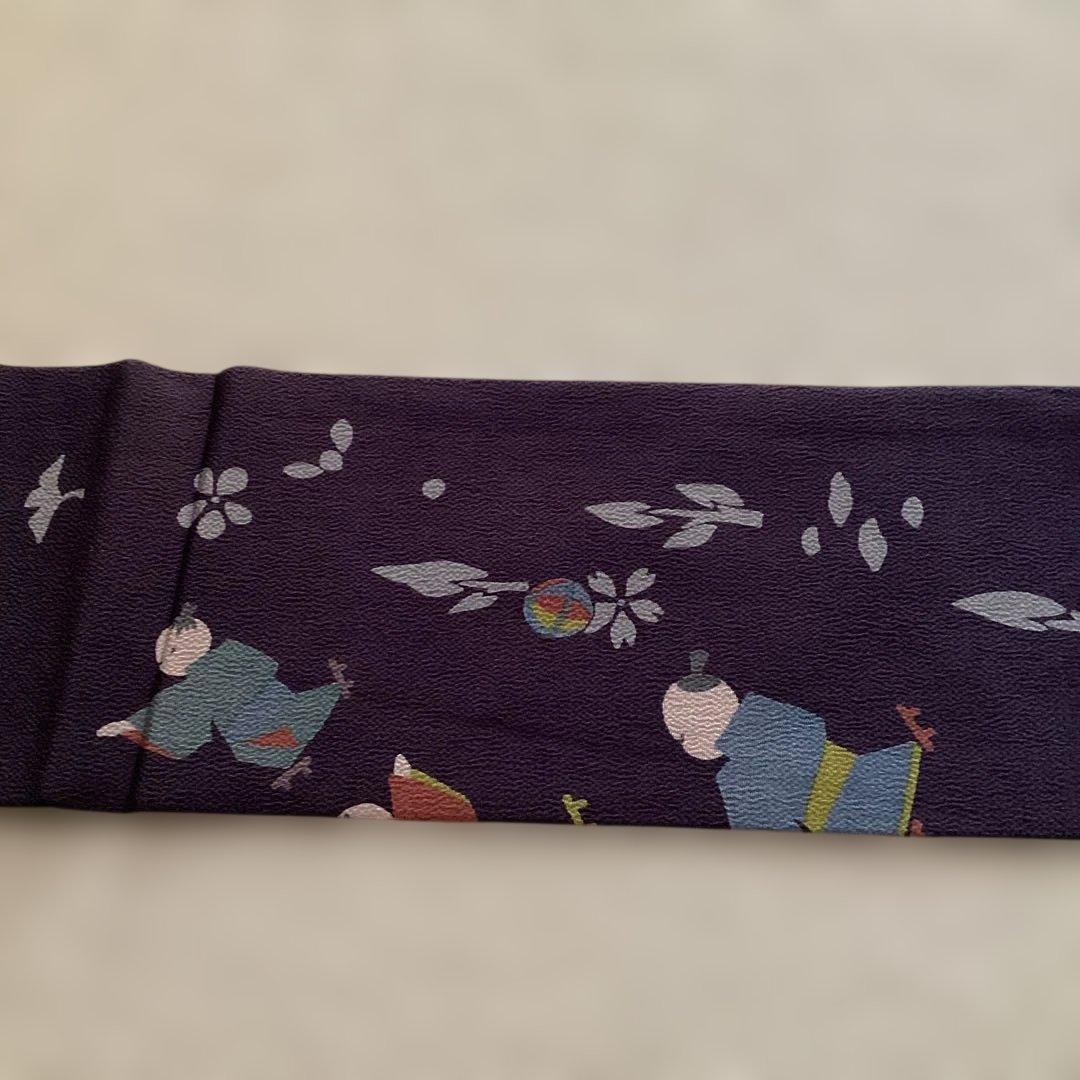 ほぼ未使用品　九寸名古屋帯 全通　正絹縮緬地　濃紫　遊ぶ童子柄　ガード加工済