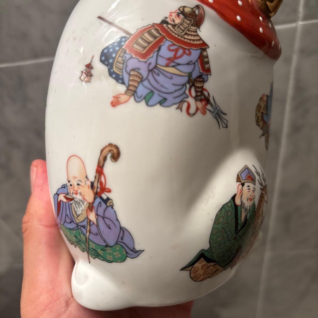 ヴィンテージ縁起の良い七福神が描かれ、可愛らしい瞳の招き猫